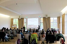 Zuhörer bei einem Vortrag